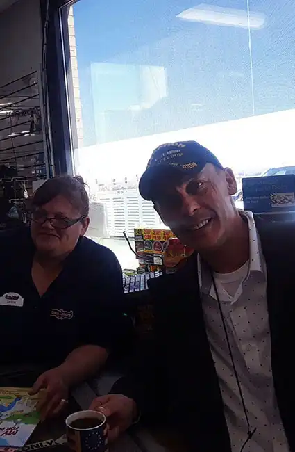 Stopping in for a snack and the author David Haave gets a request to sign My New Boots for My Daddys Farm 2022 Louisiana -- David Haave